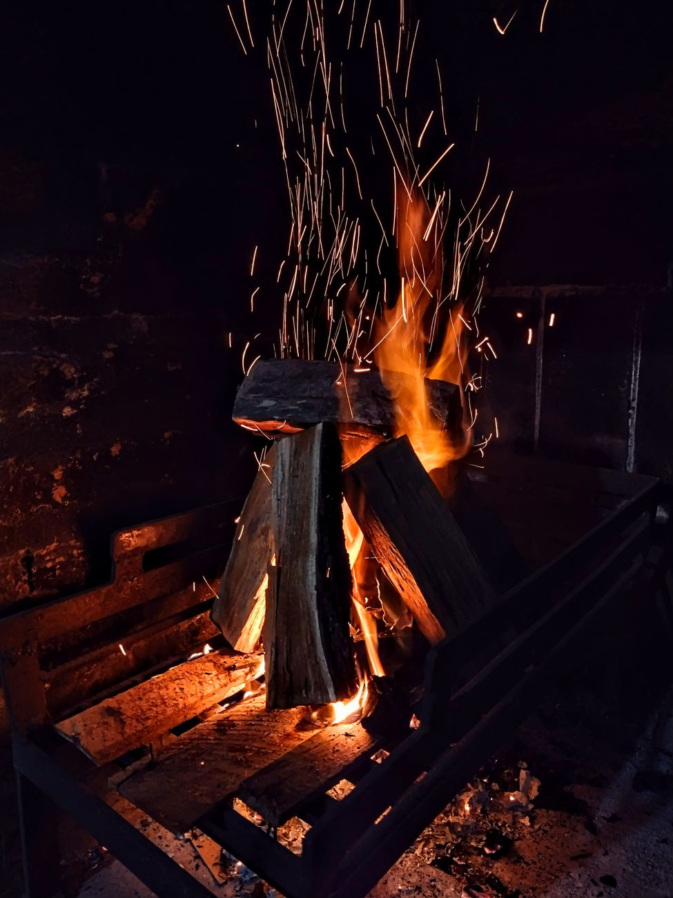Interior timber chalet lounge with fire